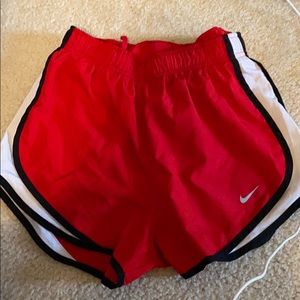 Red Nike running shorts
